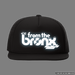 From The Bronx Reflective Logo Trucker Hat Front with Simulated Reflection